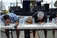 Participants with Their Face in a Plate of Spaghetti