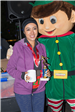 Woman Holding a Mug and Posing with an Elf