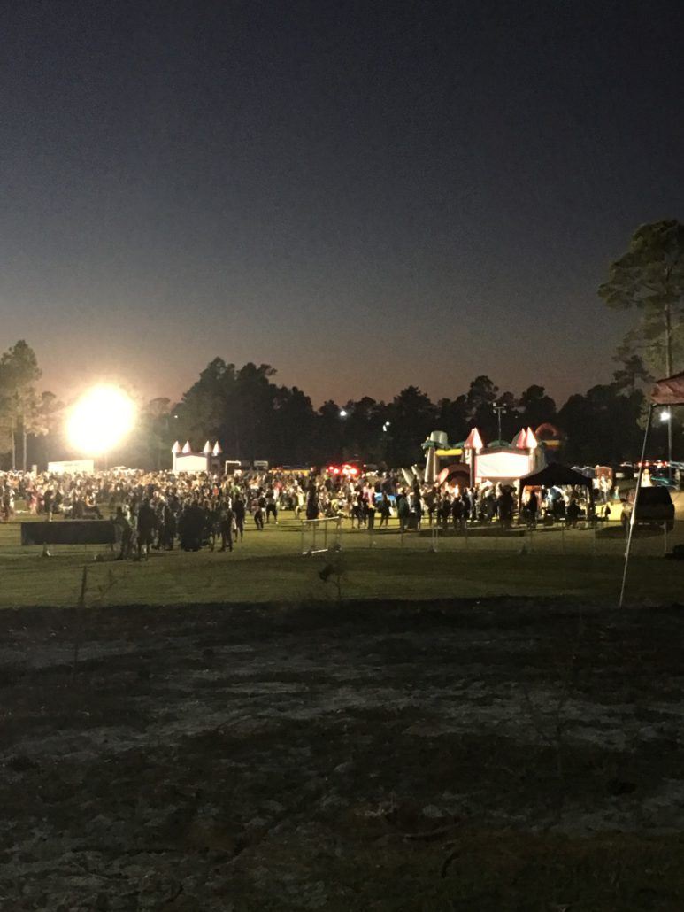 Howl-O-Scream participants in the meadow at night